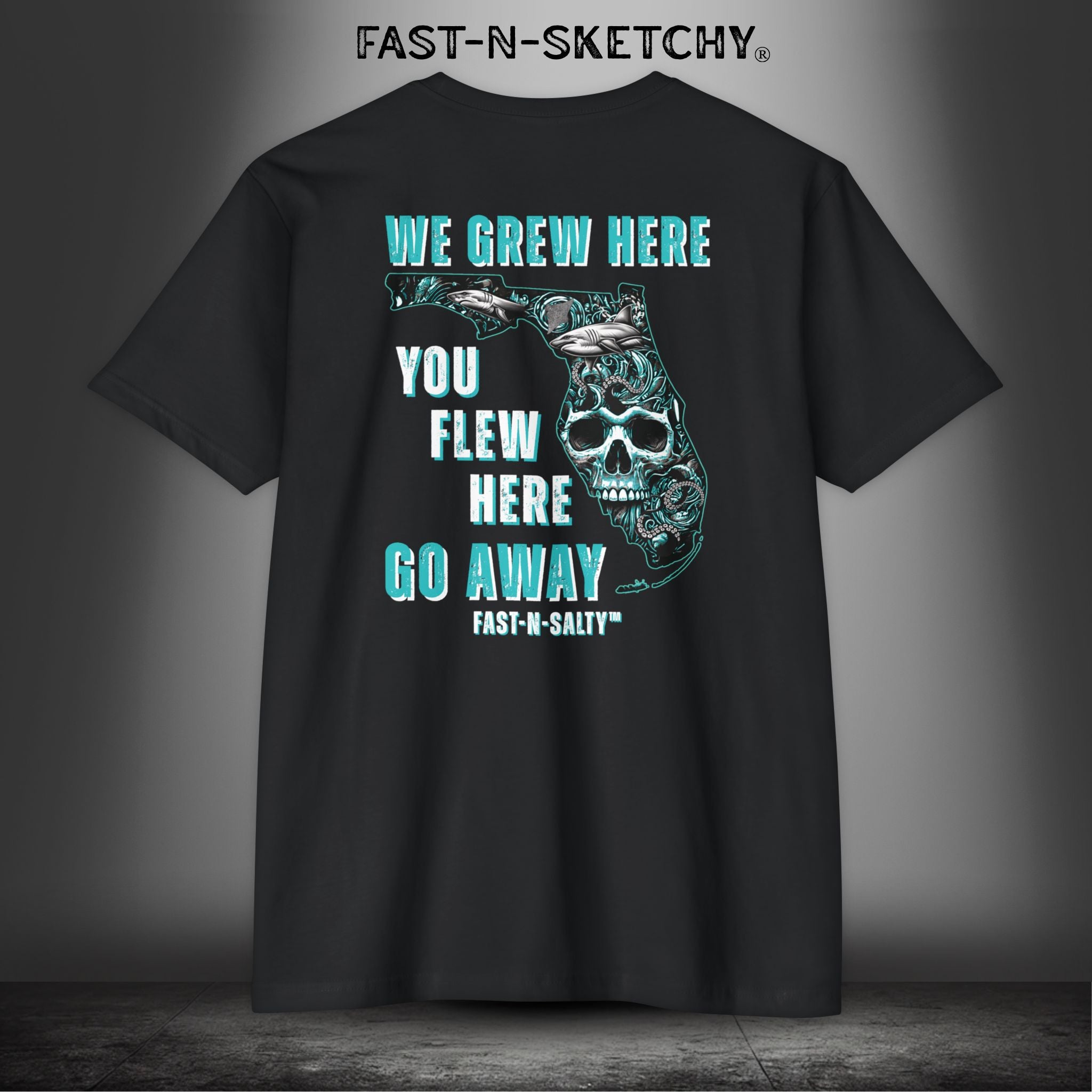 WE GREW HERE, YOU FLEW HERE, GO AWAY: Teal on Black T-Shirt Next Level 6210